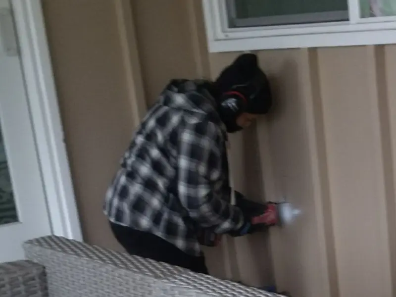 Professional electrician installing an exterior outlet in Damascus
