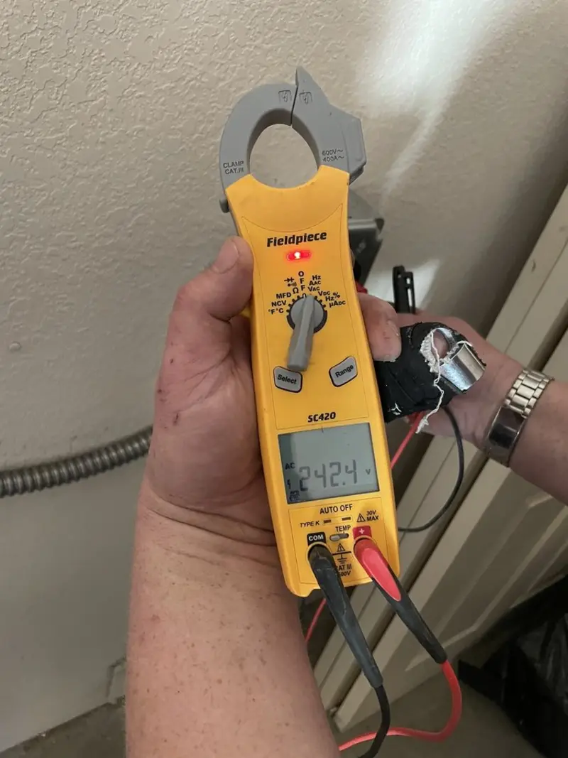 Voltage testing with clamp meter during Outlet Installation in Damascus